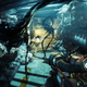 A screenshot of Prey featuring three black spider-like monsters attacking the player.